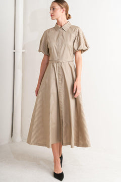 A striped woven midi dress featuring collar, raglan short puff sleeve, hidden button down, self belt and circle skirt