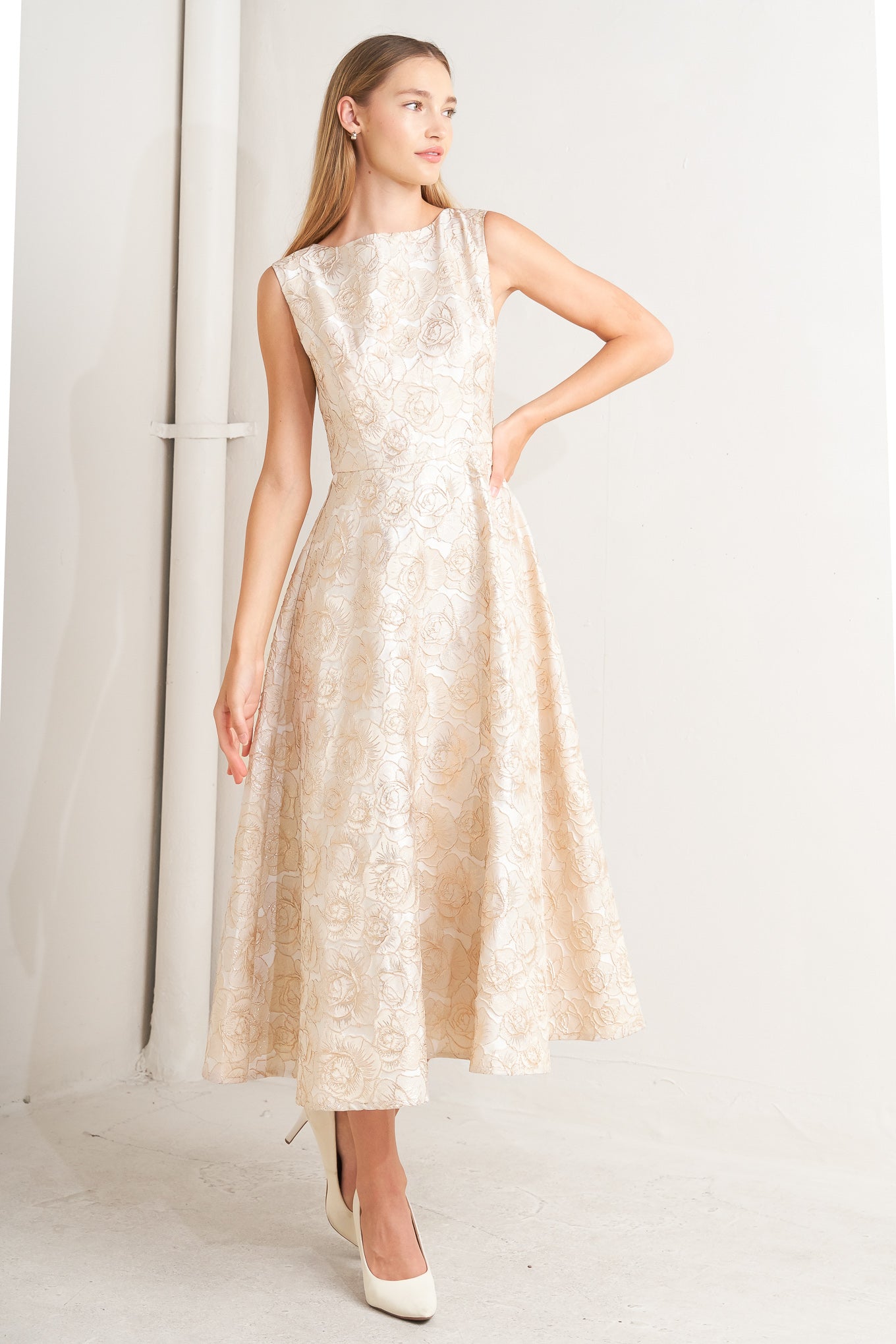 A textured woven midi dress featuring wide neckline, sleeveless, circle skirt and back zipper closure