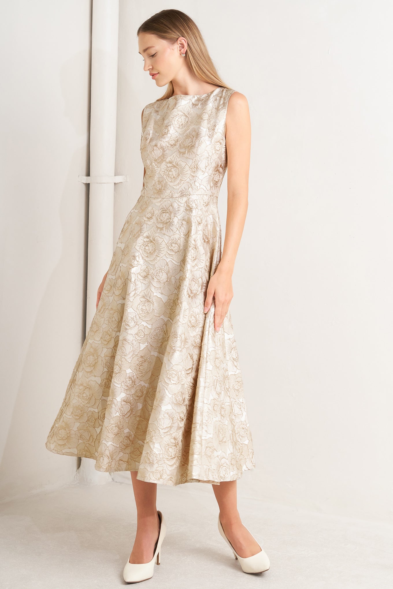 A textured woven midi dress featuring wide neckline, sleeveless, circle skirt and back zipper closure