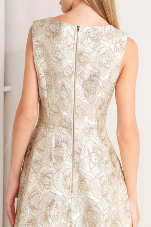 A textured woven midi dress featuring wide neckline, sleeveless, circle skirt and back zipper closure