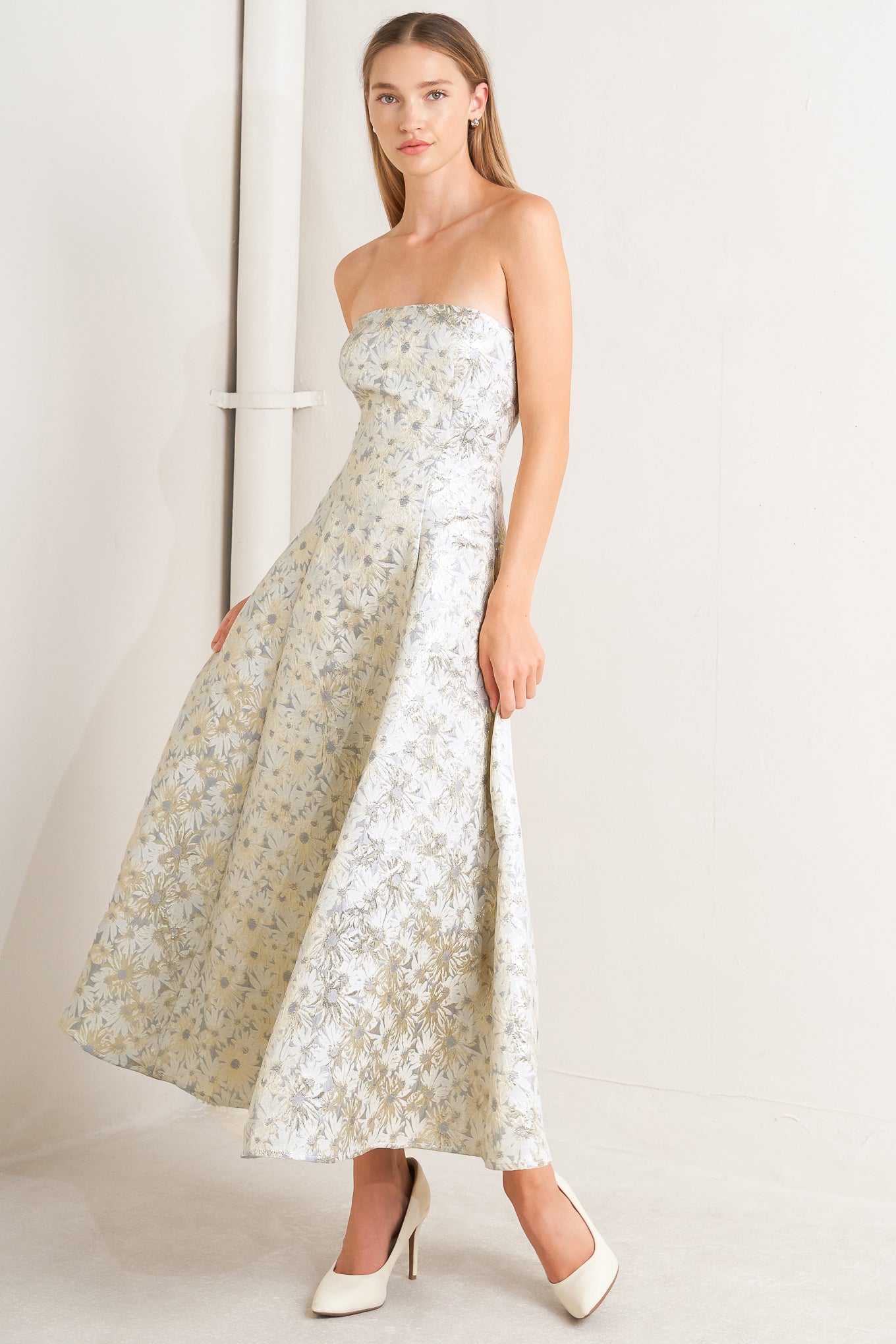 A woven jacquard woven midi dress featuring strapless neckline, circle skirt and smocked back with zipper closure
