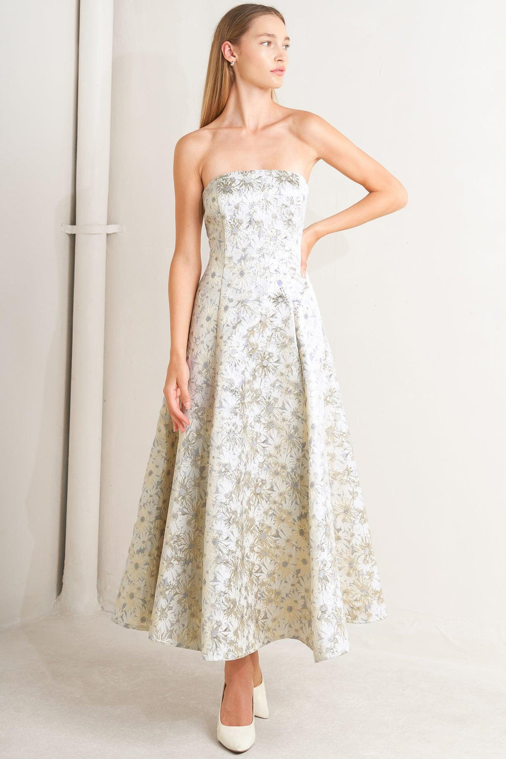 A woven jacquard woven midi dress featuring strapless neckline, circle skirt and smocked back with zipper closure