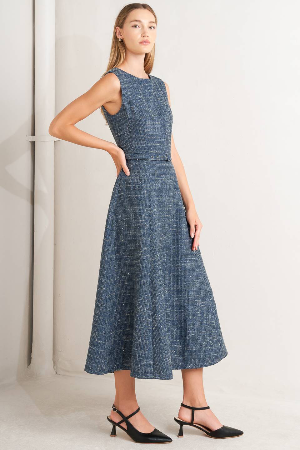 A woven tweed midi dress featuring round neckline, sleeveless, self belt, circle skirt and back zipper closure