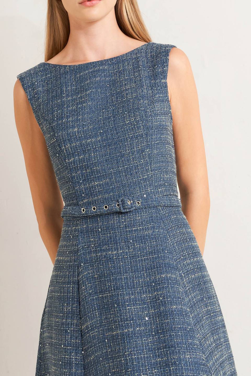 A woven tweed midi dress featuring round neckline, sleeveless, self belt, circle skirt and back zipper closure