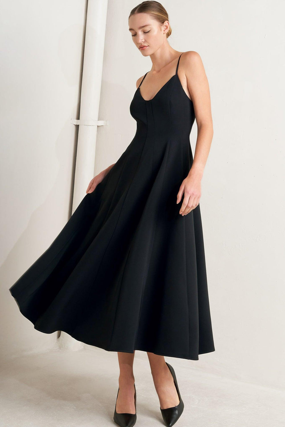 A solid woven midi dress featuring cami top, circle skirt, low back and zipper closure

Details:

Self: 95% Polyester 5% Spandex

Lining: 100% Polyester

Size &amp; Fit

Model is 5`8" And Wearing Size Small&nbsp;
Measurements Taken From Size Small&nbsp;
Approx. Length: 50"