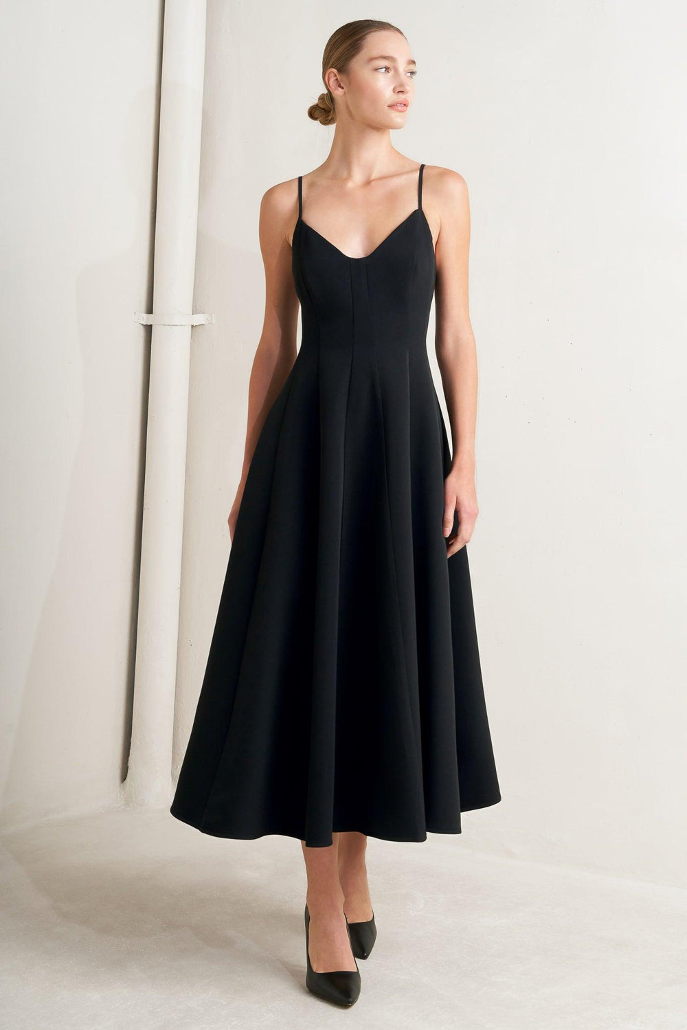 A solid woven midi dress featuring cami top, circle skirt, low back and zipper closure

Details:

Self: 95% Polyester 5% Spandex

Lining: 100% Polyester

Size &amp; Fit

Model is 5`8" And Wearing Size Small&nbsp;
Measurements Taken From Size Small&nbsp;
Approx. Length: 50"