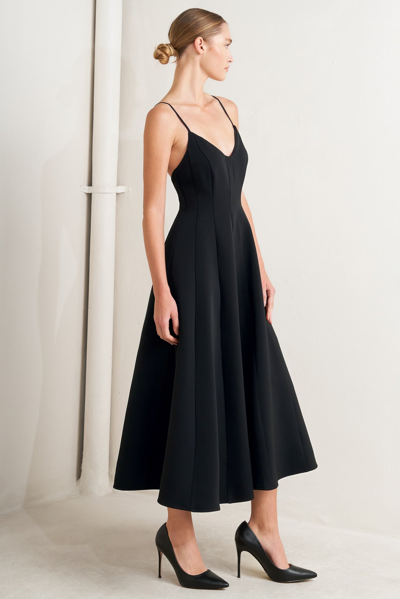 A solid woven midi dress featuring cami top, circle skirt, low back and zipper closure

Details:

Self: 95% Polyester 5% Spandex

Lining: 100% Polyester

Size & Fit

-Model is 5`8" And Wearing Size Small
-Measurements Taken From Size Small
-Approx. Length: 50"