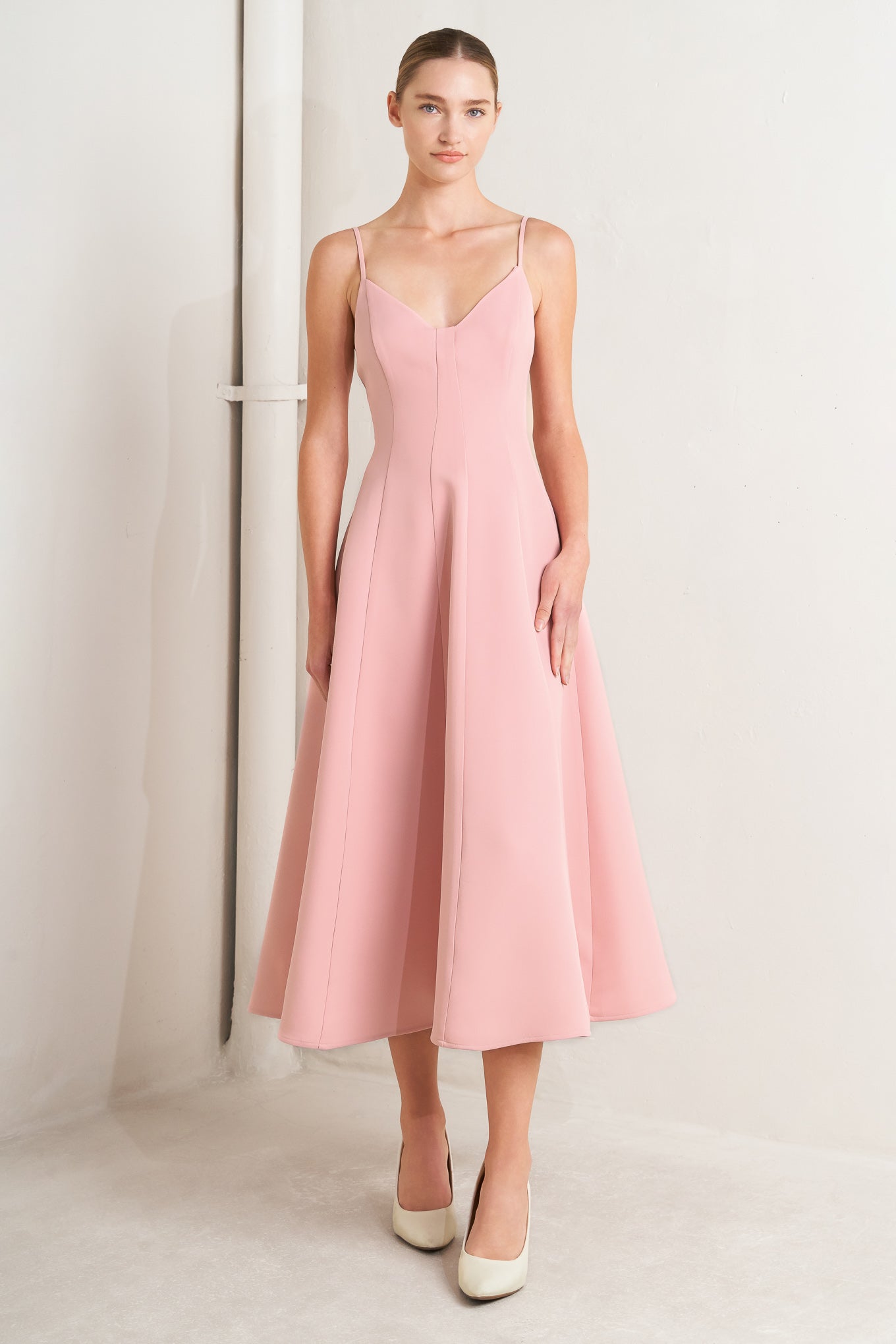 A solid woven midi dress featuring cami top, circle skirt, low back and zipper closure

Details:

Self: 95% Polyester 5% Spandex

Lining: 100% Polyester

Size &amp; Fit

Model is 5`8" And Wearing Size Small&nbsp;
Measurements Taken From Size Small&nbsp;
Approx. Length: 50"