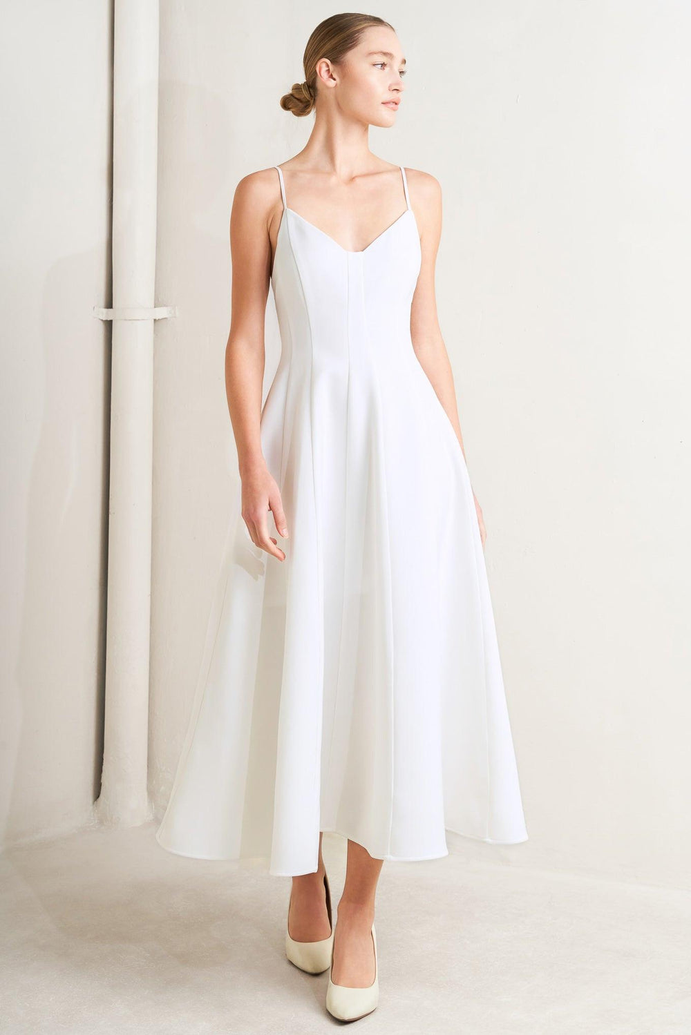 A solid woven midi dress featuring cami top, circle skirt, low back and zipper closure

Details:

Self: 95% Polyester 5% Spandex

Lining: 100% Polyester

Size &amp; Fit

Model is 5`8" And Wearing Size Small&nbsp;
Measurements Taken From Size Small&nbsp;
Approx. Length: 50"