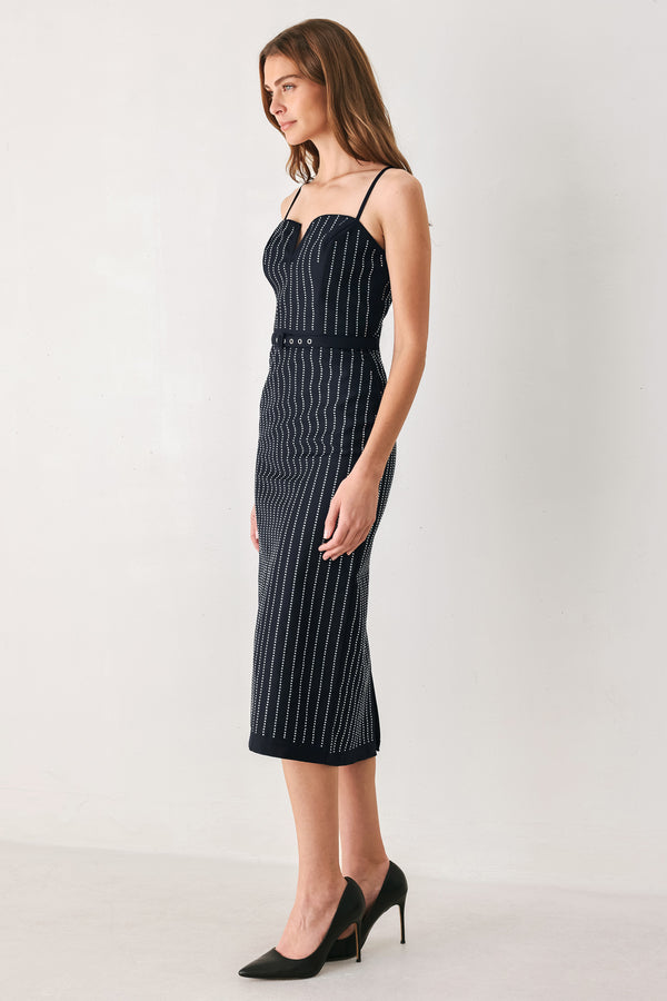 A woman modeling a sleeveless navy midi dress with thin white vertical rhinestone pinstripes, a sweetheart neckline, and a matching navy belt with silver-tone studs | FREEMARKET