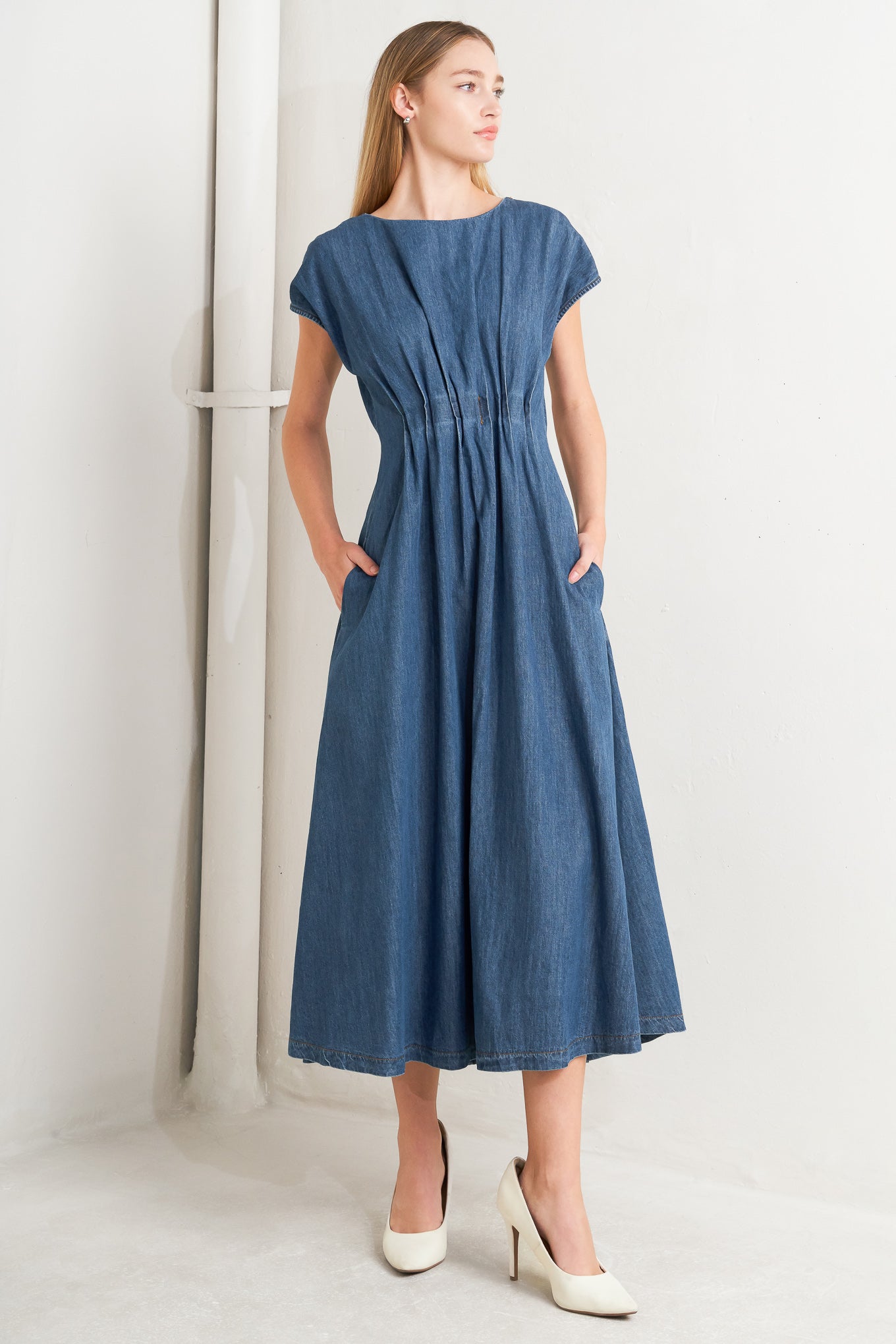 
A washed denim midi dress featuring round neckline, short sleeve, pleated corset waist, full skirt and back zipper closure

Details:

Self : 80% Cotton 20% Polyester

Size &amp; Fit

- Model is 5`8" And Wearing Size Small
- Measurements Taken From Size Small
- Approx. Length: 50"