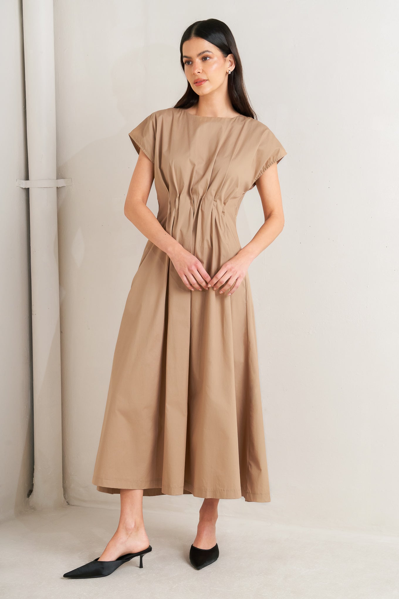 A solid woven midi dress featuring round neckline, short dolman sleeve, pleated corset waist, side pocket, full skirt and back zipper closure

Details:

Self : 100% Cotton

Size &amp; Fit

- Model is 5`8" And Wearing Size Small
- Measurements Taken From Size Small
- Approx. Length: 51"