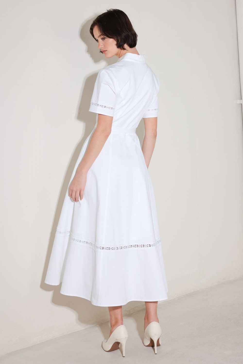 
A solid woven midi dress featuring collar, short sleeve with lace inset, front button down, self belt, circle skirt with lace inset bottom

Details:

Self : 100% Cotton
Lining : 100% Polyester

Size &amp; Fit

- Model is 5`8" And Wearing Size Small
- Measurements Taken From Size Small
- Approx. Length: 50"