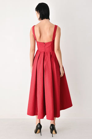 A woman modeling a sleeveless red midi dress with a square neckline, structured bodice, and full pleated skirt | FREEMARKET