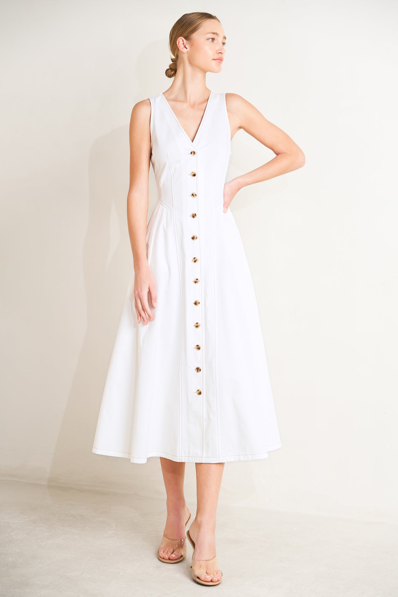 
A solid woven midi dress featuring front/back V neckline, sleeveless, button down and circle skirt

Details:

Self : 100% Cotton

Size &amp; Fit

- Model is 5`8" And Wearing Size Small
- Measurements Taken From Size Small
- Approx. Length: 49"