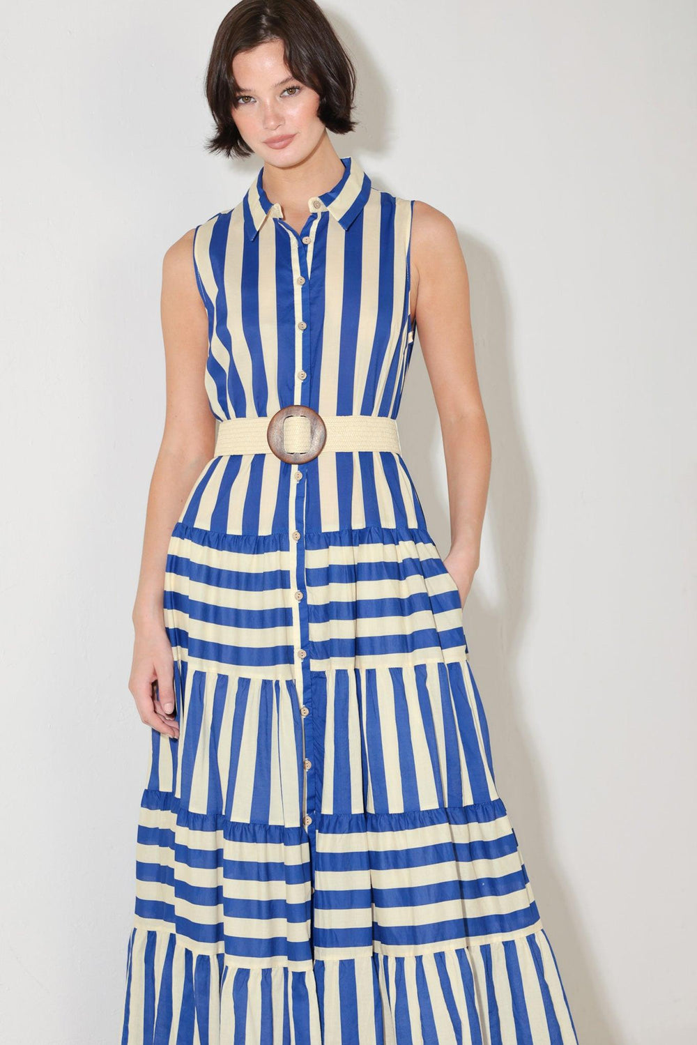 
A striped maxi dress featuring collar, sleeveless, button down, contrasting belt and tiered skirt

Details:

Self : 100% Cotton
Lining : 100% Polyester

Size &amp; Fit

- Model is 5`8" And Wearing Size Small
- Measurements Taken From Size Small
- Approx. Length: 60"