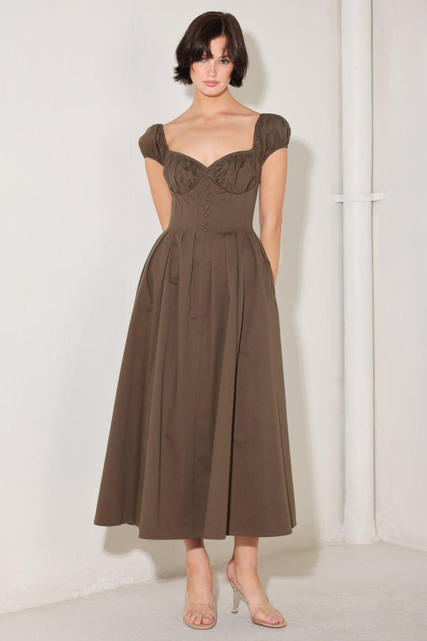 
A solid woven midi dress featuring sweetheart neckline, short sleeve, ruched bust, front button detail, full skirt and back zipper closure

Details:

Self : 100% Cotton

Size &amp; Fit

- Model is 5`8" And Wearing Size Small
- Measurements Taken From Size Small
- Approx. Length: 50"