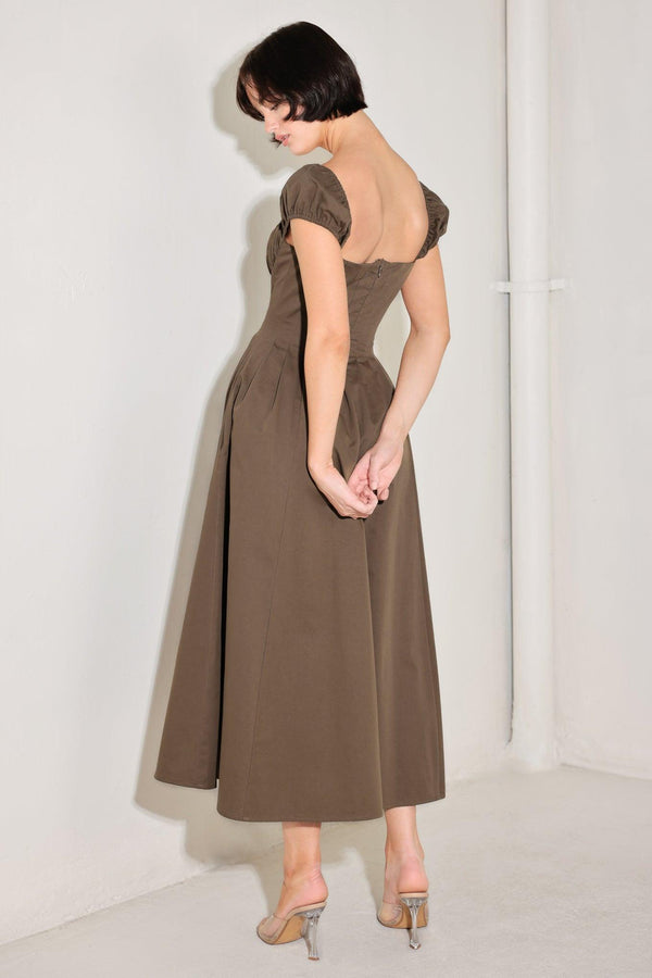 
A solid woven midi dress featuring sweetheart neckline, short sleeve, ruched bust, front button detail, full skirt and back zipper closure

Details:

Self : 100% Cotton

Size &amp; Fit

- Model is 5`8" And Wearing Size Small
- Measurements Taken From Size Small
- Approx. Length: 50"