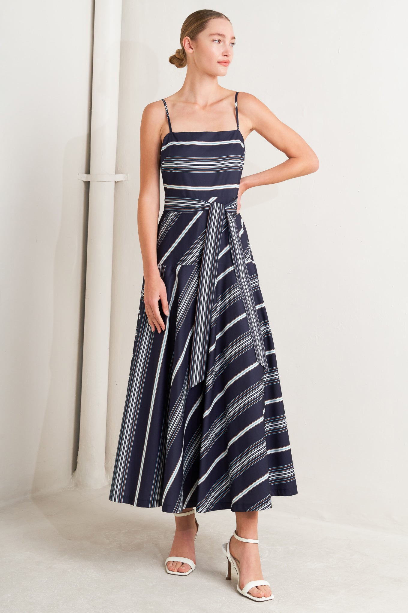
A striped woven midi dress featuring straight neckline, straps, self sash tie, circle skirt and back zipper closure

Details:

Self : 100% Cotton

Size &amp; Fit

- Model is 5`8" And Wearing Size Small
- Measurements Taken From Size Small
- Approx. Length: 53" Flying Tomato