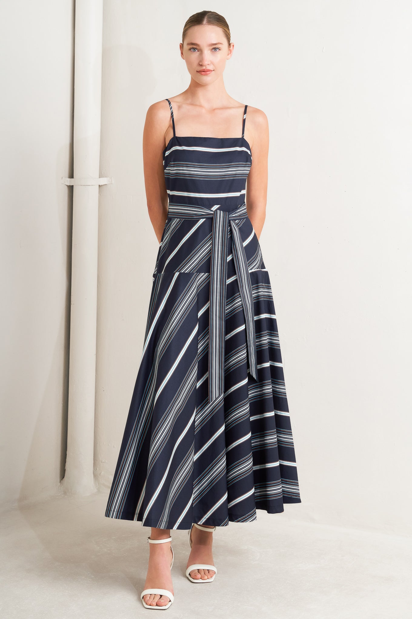 
A striped woven midi dress featuring straight neckline, straps, self sash tie, circle skirt and back zipper closure

Details:

Self : 100% Cotton

Size &amp; Fit

- Model is 5`8" And Wearing Size Small
- Measurements Taken From Size Small
- Approx. Length: 53" Flying Tomato