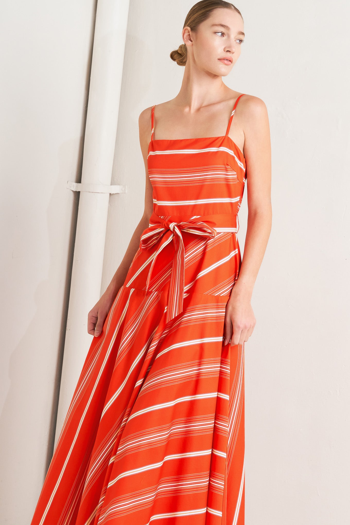
A striped woven midi dress featuring straight neckline, straps, self sash tie, circle skirt and back zipper closure

Details:

Self : 100% Cotton

Size &amp; Fit

- Model is 5`8" And Wearing Size Small
- Measurements Taken From Size Small
- Approx. Length: 53" Flying Tomato