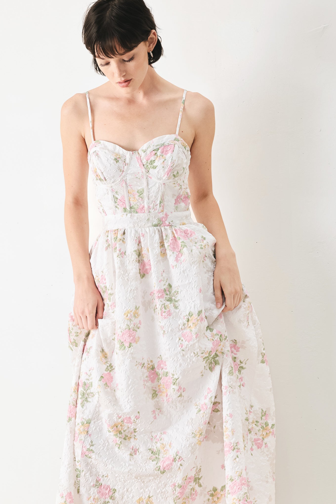 Woman wearing a floral midi dress featuring bustier top, straps, full skirt and back zipper closure | FREEMARKET