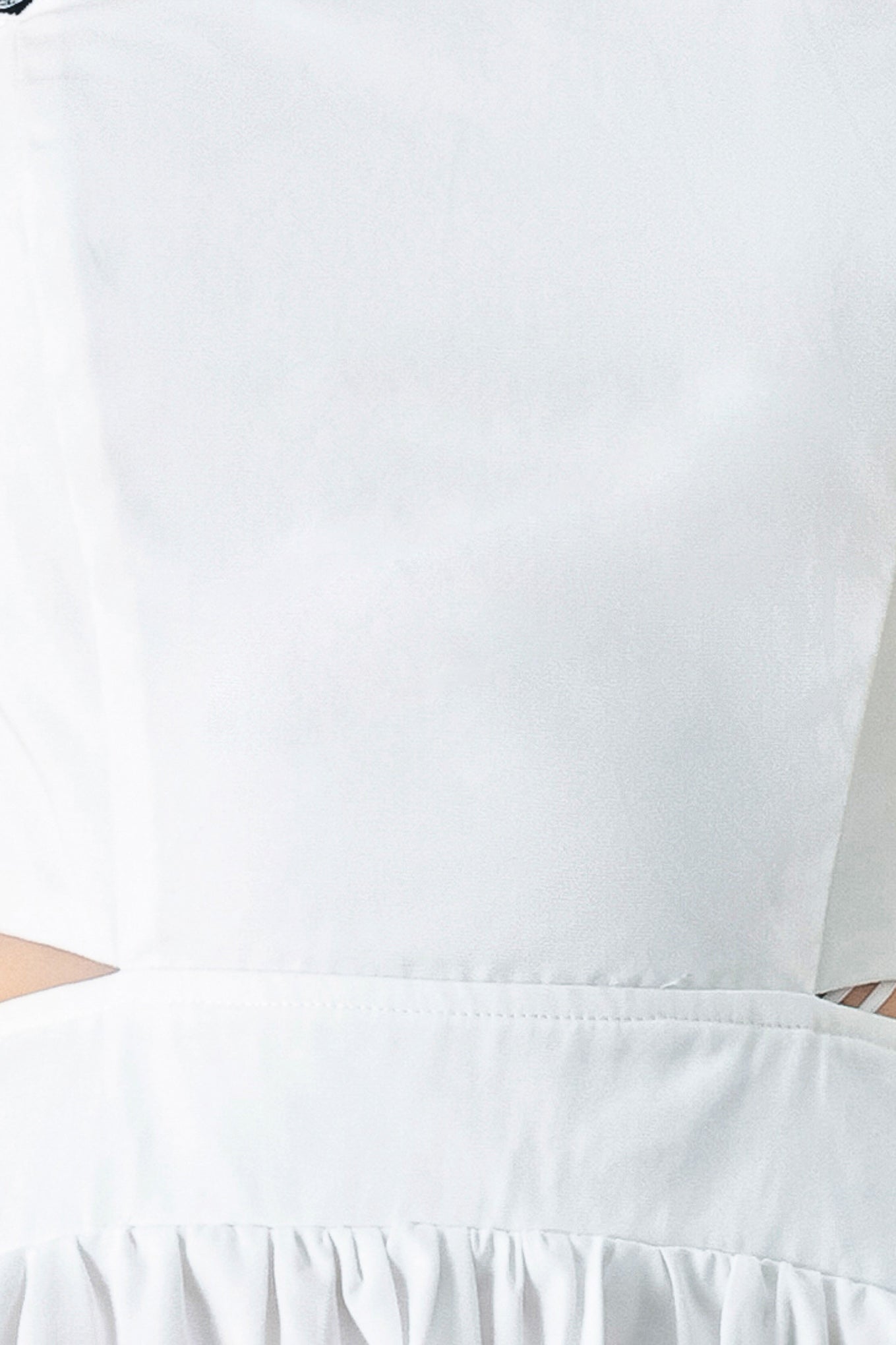 A solid woven midi dress featuring scalloped neckline, straps, side cut out, full skirt, smocked back bodice with zipper closure