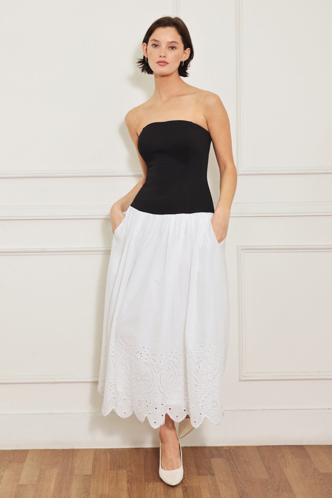 
A knit/woven combination midi dress featuring strapless knit top, woven eyelet full skirt and back zipper closure

Details:

Self : 100% Cotton
Contrast : 49% Rayon 44% Polyester 7% Spandex
Lining : 100% Polyester

Size &amp; Fit

- Model is 5`8" And Wearing Size Small
- Measurements Taken From Size Small
- Approx. Length: 43"