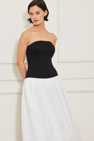 
A knit/woven combination midi dress featuring strapless knit top, woven eyelet full skirt and back zipper closure

Details:

Self : 100% Cotton
Contrast : 49% Rayon 44% Polyester 7% Spandex
Lining : 100% Polyester

Size &amp; Fit

- Model is 5`8" And Wearing Size Small
- Measurements Taken From Size Small
- Approx. Length: 43"