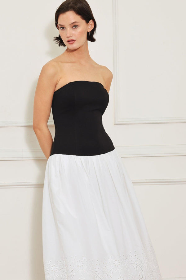
A knit/woven combination midi dress featuring strapless knit top, woven eyelet full skirt and back zipper closure

Details:

Self : 100% Cotton
Contrast : 49% Rayon 44% Polyester 7% Spandex
Lining : 100% Polyester

Size &amp; Fit

- Model is 5`8" And Wearing Size Small
- Measurements Taken From Size Small
- Approx. Length: 43"