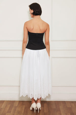 
A knit/woven combination midi dress featuring strapless knit top, woven eyelet full skirt and back zipper closure

Details:

Self : 100% Cotton
Contrast : 49% Rayon 44% Polyester 7% Spandex
Lining : 100% Polyester

Size &amp; Fit

- Model is 5`8" And Wearing Size Small
- Measurements Taken From Size Small
- Approx. Length: 43"