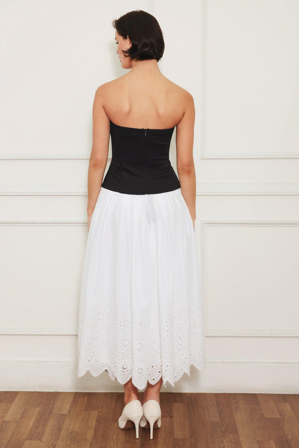 
A knit/woven combination midi dress featuring strapless knit top, woven eyelet full skirt and back zipper closure

Details:

Self : 100% Cotton
Contrast : 49% Rayon 44% Polyester 7% Spandex
Lining : 100% Polyester

Size &amp; Fit

- Model is 5`8" And Wearing Size Small
- Measurements Taken From Size Small
- Approx. Length: 43"