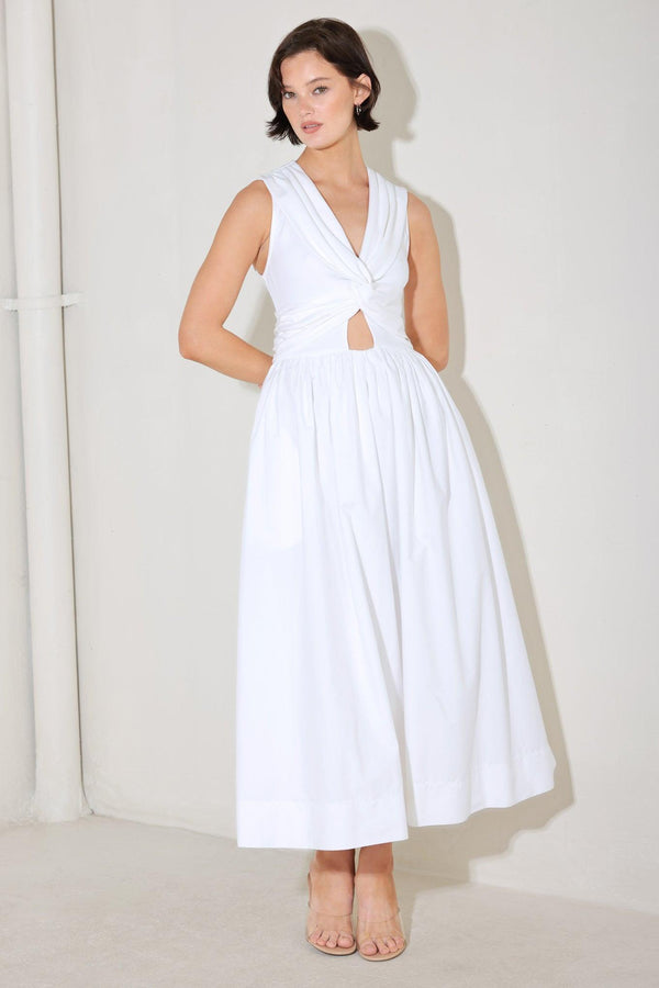 
A solid midi dress featuring knit top with V neckline, sleeveless, twist front detail with cut out, full woven skirt and back zipper closure

Details:

Self : 100% Cotton
Contrast : 96% Cotton 4% Spandex
Lining : 100% Polyester

Size &amp; Fit

- Model is 5`8" And Wearing Size Small
- Measurements Taken From Size Small
- Approx. Length: 52"