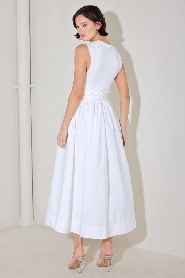 
A solid midi dress featuring knit top with V neckline, sleeveless, twist front detail with cut out, full woven skirt and back zipper closure

Details:

Self : 100% Cotton
Contrast : 96% Cotton 4% Spandex
Lining : 100% Polyester

Size &amp; Fit

- Model is 5`8" And Wearing Size Small
- Measurements Taken From Size Small
- Approx. Length: 52"