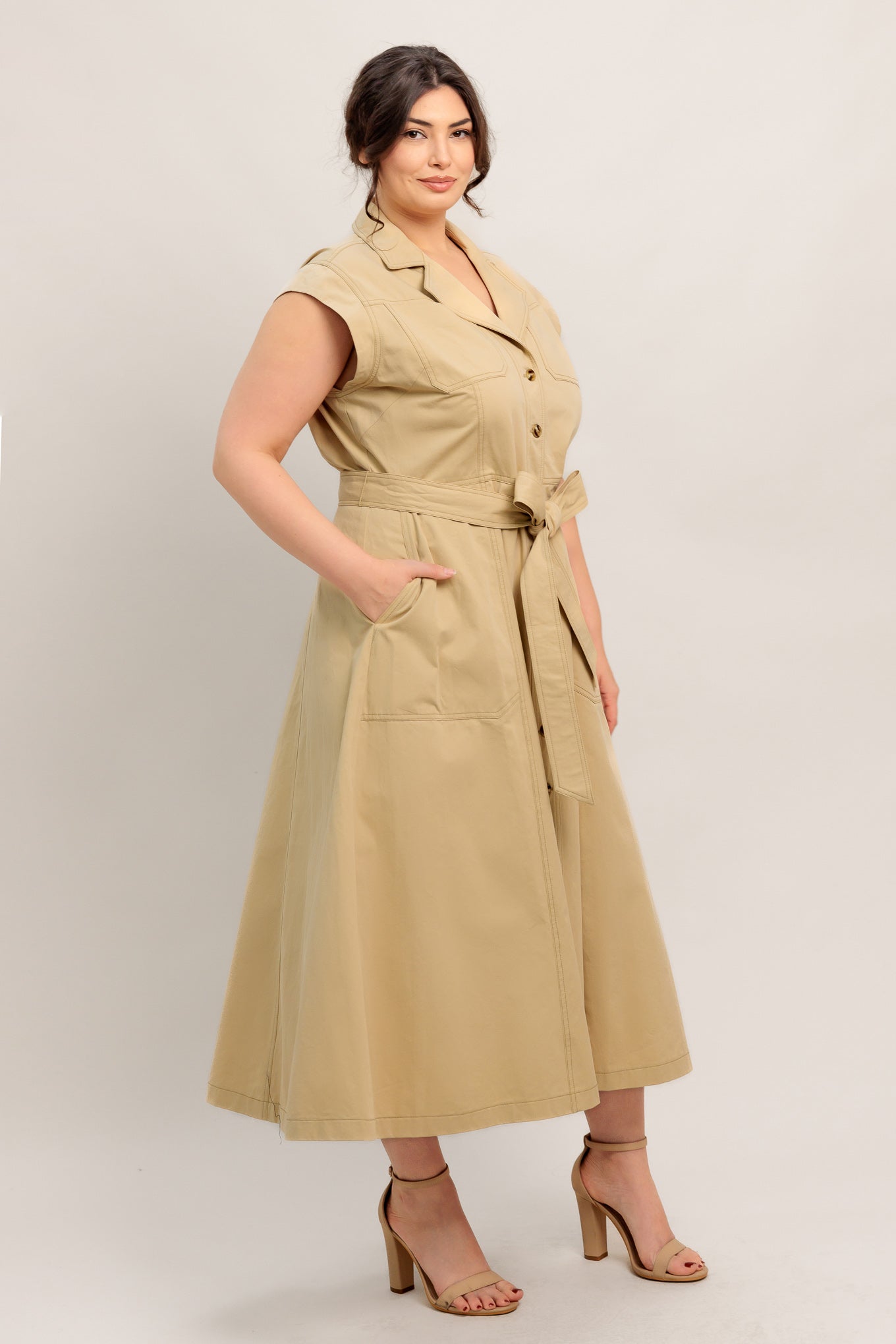 
A solid woven midi dress featuring collar, cap sleeve, pockets, button down, self sash tie and circle skirt

Details:

Self : 100% Cotton

Size &amp; Fit

- Model is 5`8" And Wearing Size Small
- Measurements Taken From Size Small
- Approx. Length: 49"