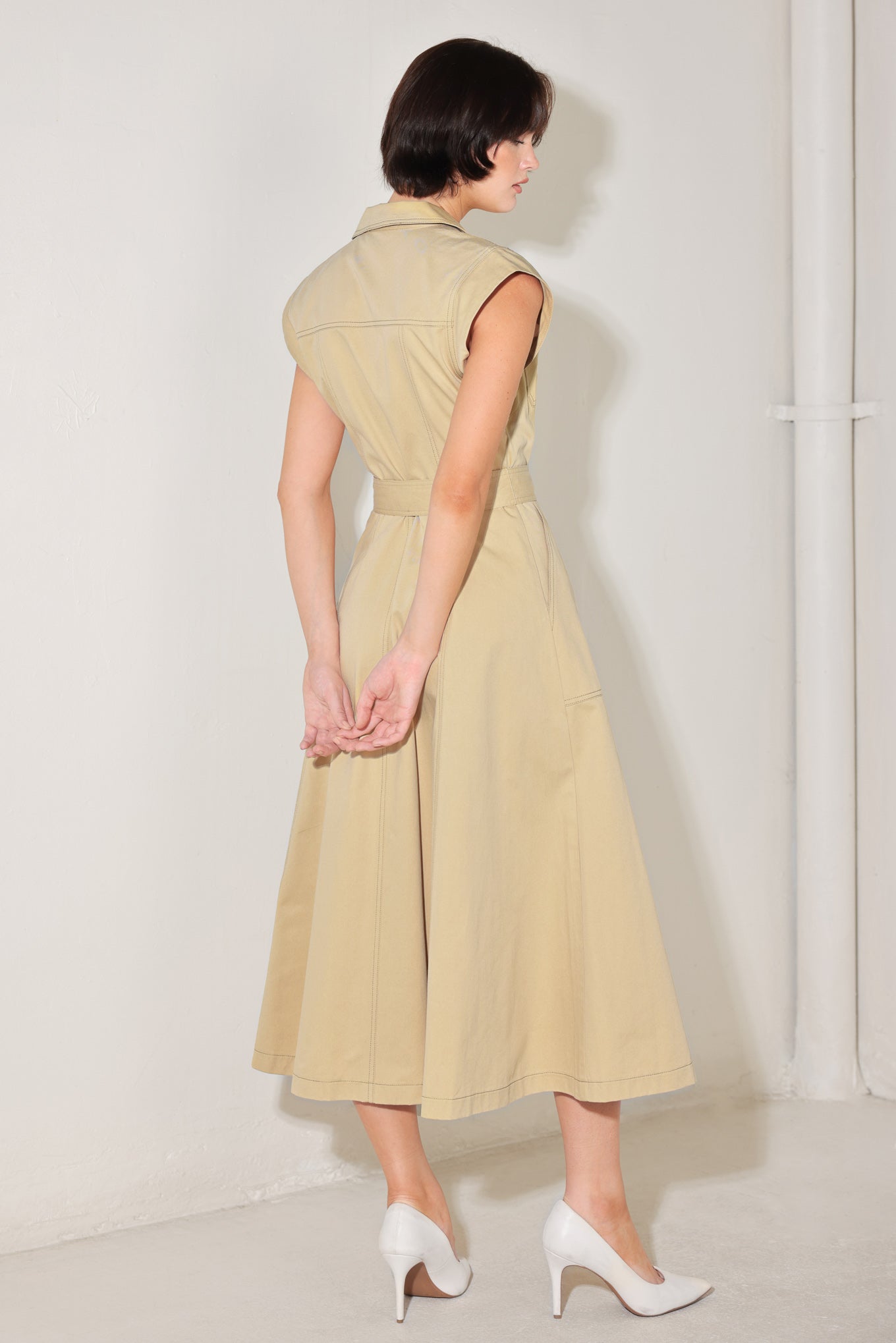 
A solid woven midi dress featuring collar, cap sleeve, pockets, button down, self sash tie and circle skirt

Details:

Self : 100% Cotton

Size &amp; Fit

- Model is 5`8" And Wearing Size Small
- Measurements Taken From Size Small
- Approx. Length: 49"
