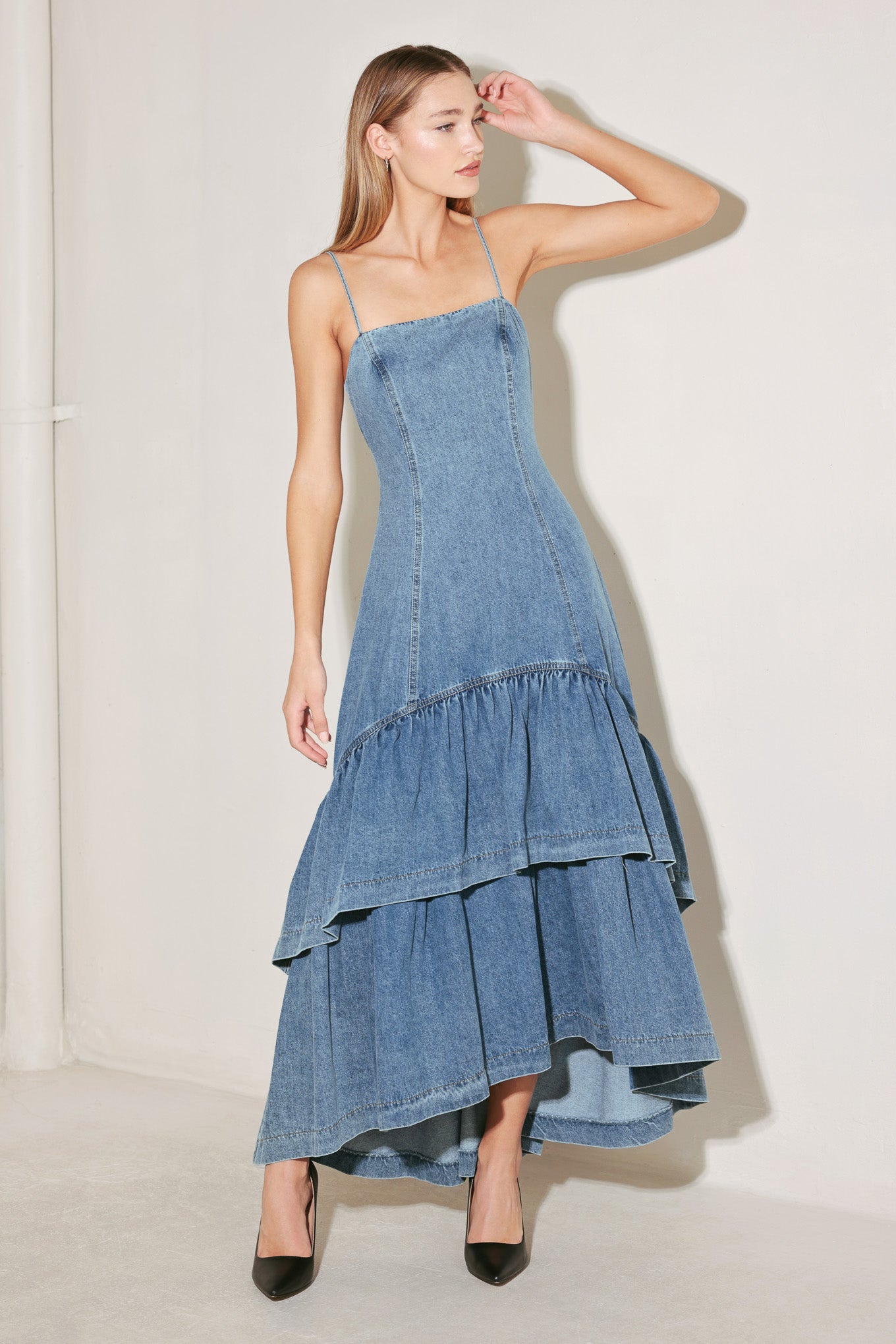 
A washed denim midi dress featuring straight neckline, straps, double layer hi-lo and back zipper closure

Details:

Self : 90% Cotton 10% Polyester

Size &amp; Fit

- Model is 5`8" And Wearing Size Small
- Measurements Taken From Size Small
- Approx. Length: 56"