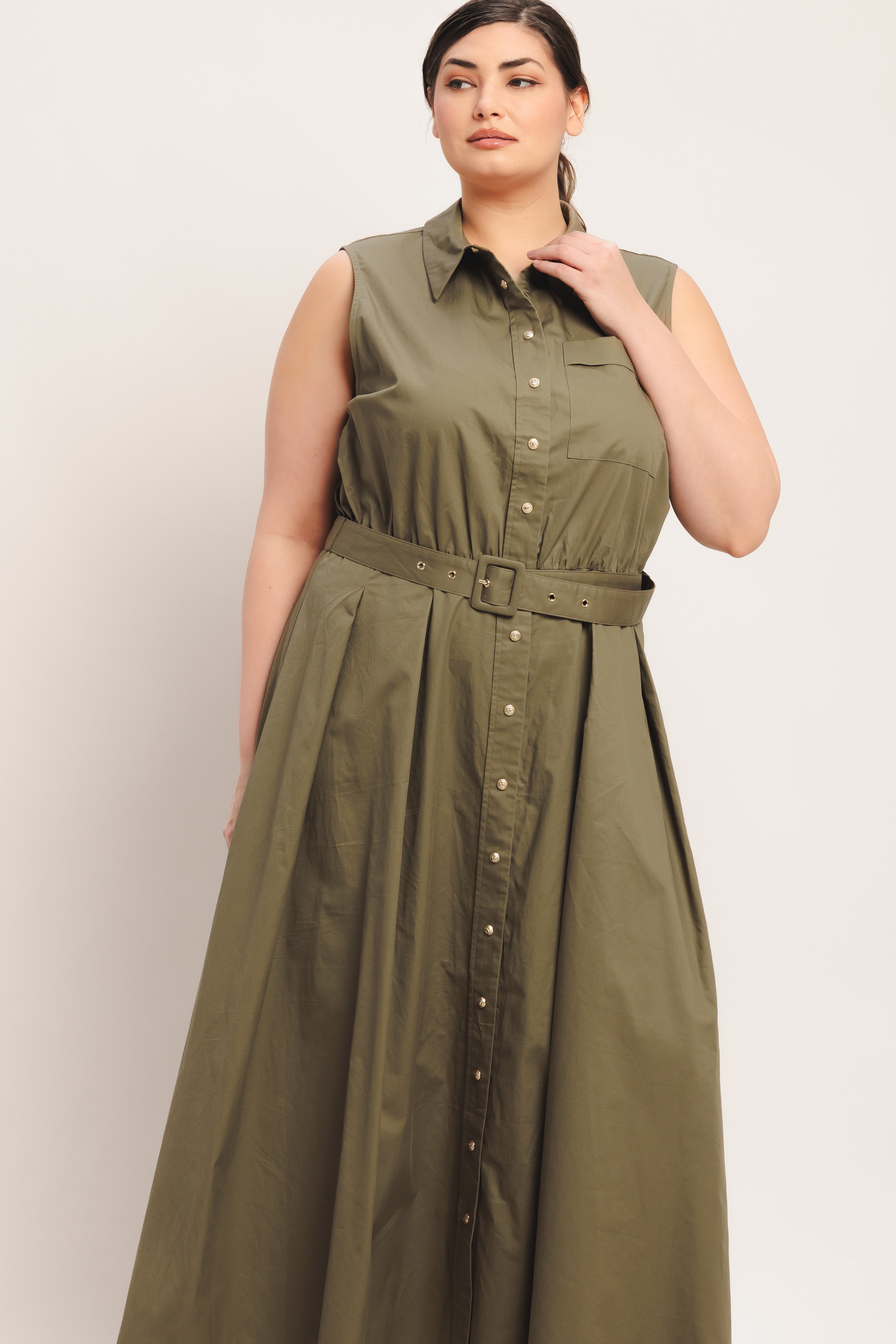 
A solid woven midi dress featuring collar, sleeveless, front button down, self belt and full circle skirt

Details:

Self : 100% Cotton

Size &amp; Fit

- Model is 5`8" And Wearing Size Small
- Measurements Taken From Size Small
- Approx. Length: 52"