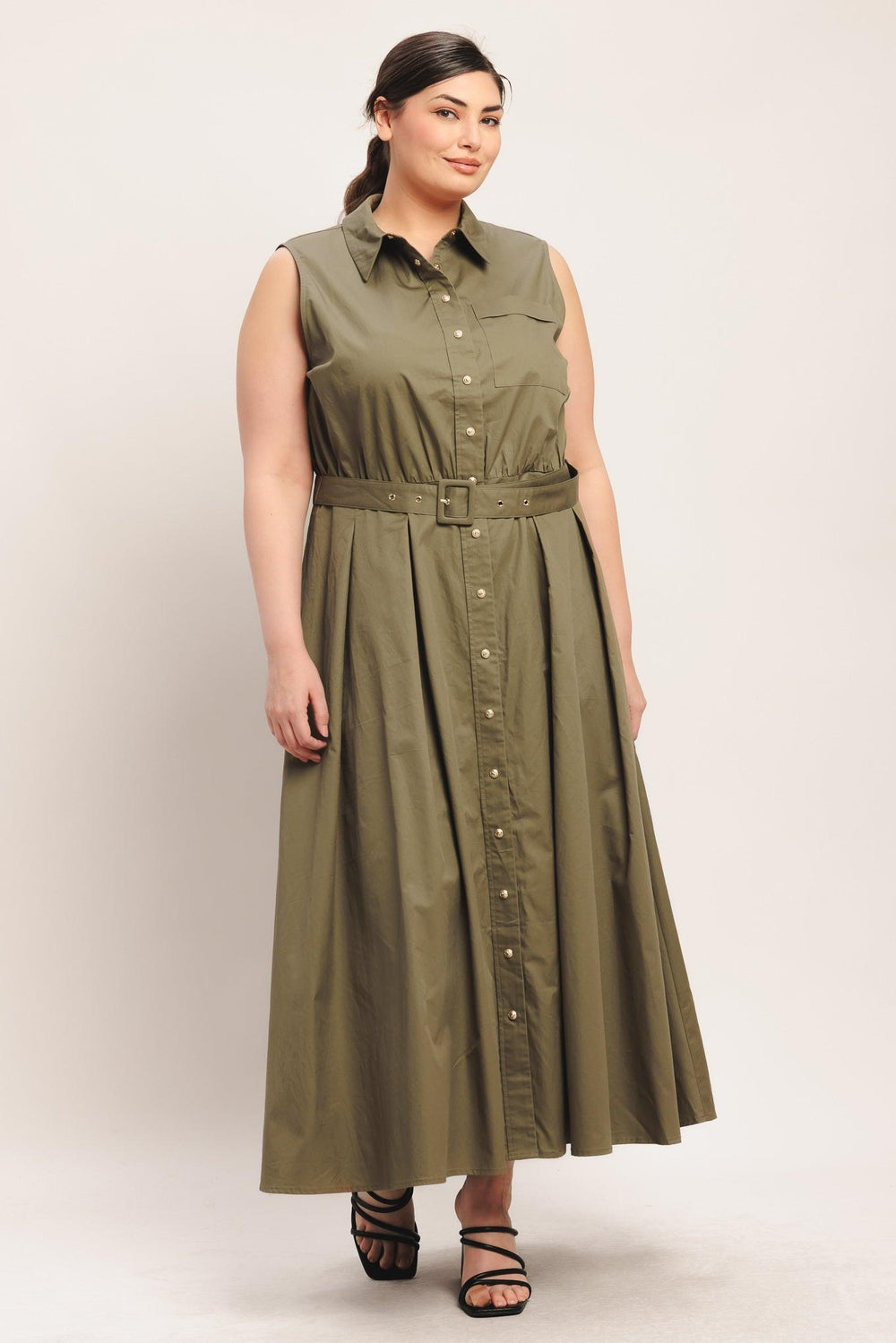
A solid woven midi dress featuring collar, sleeveless, front button down, self belt and full circle skirt

Details:

Self : 100% Cotton

Size &amp; Fit

- Model is 5`8" And Wearing Size Small
- Measurements Taken From Size Small
- Approx. Length: 52"