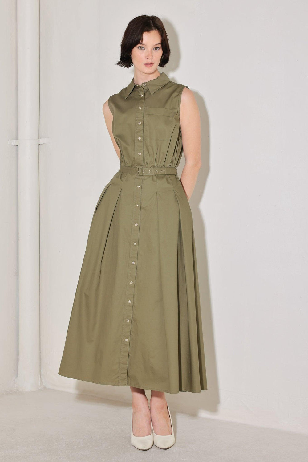 
A solid woven midi dress featuring collar, sleeveless, front button down, self belt and full circle skirt

Details:

Self : 100% Cotton

Size &amp; Fit

- Model is 5`8" And Wearing Size Small
- Measurements Taken From Size Small
- Approx. Length: 52"