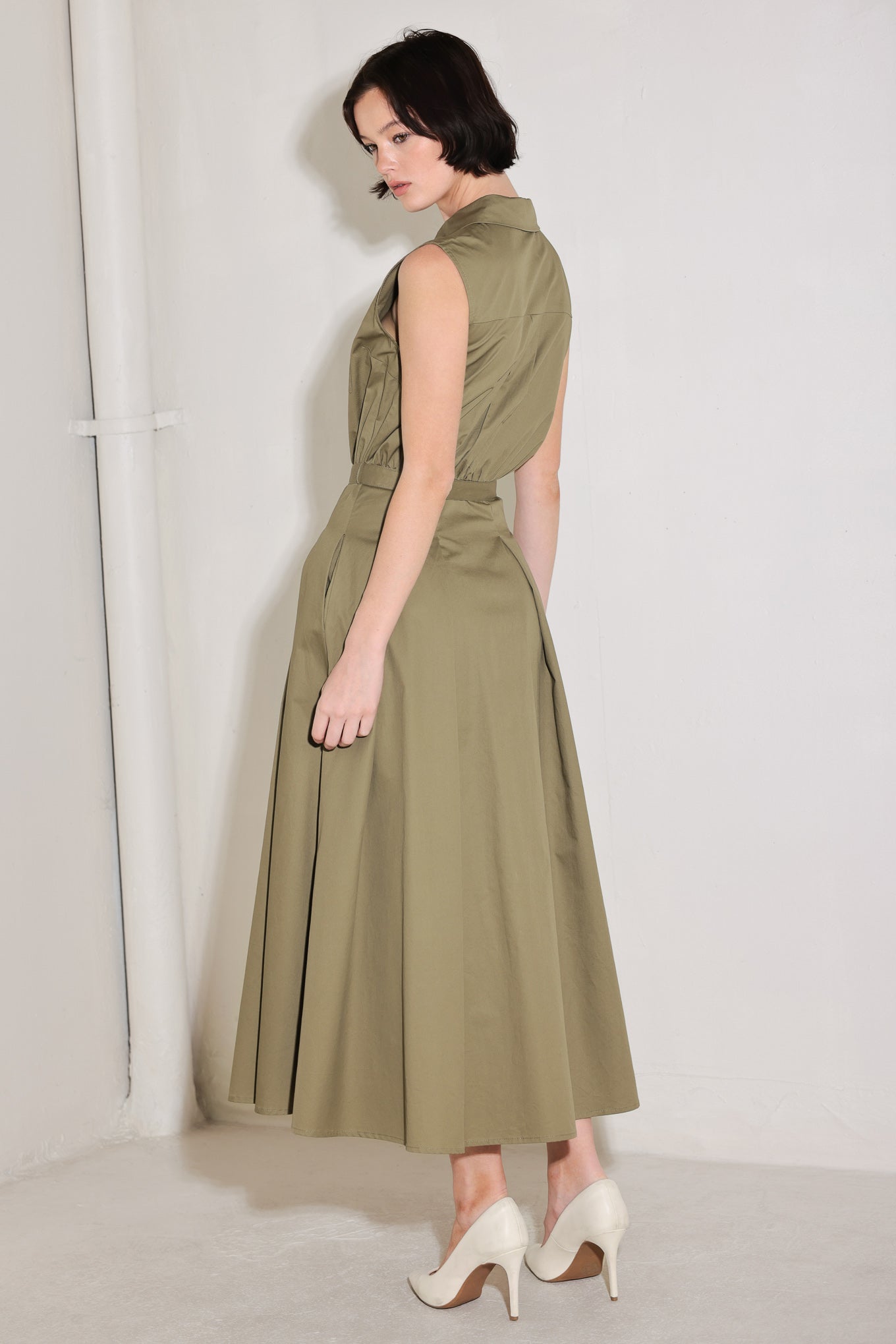 
A solid woven midi dress featuring collar, sleeveless, front button down, self belt and full circle skirt

Details:

Self : 100% Cotton

Size &amp; Fit

- Model is 5`8" And Wearing Size Small
- Measurements Taken From Size Small
- Approx. Length: 52"