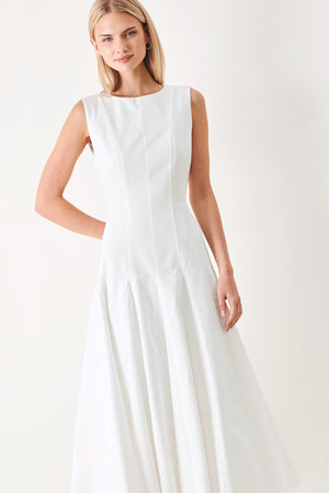 Woman wearing a white sleeveless midi dress featuring round neckline, sleeveless, full circle skirt and back zipper closure | FREEMARKET