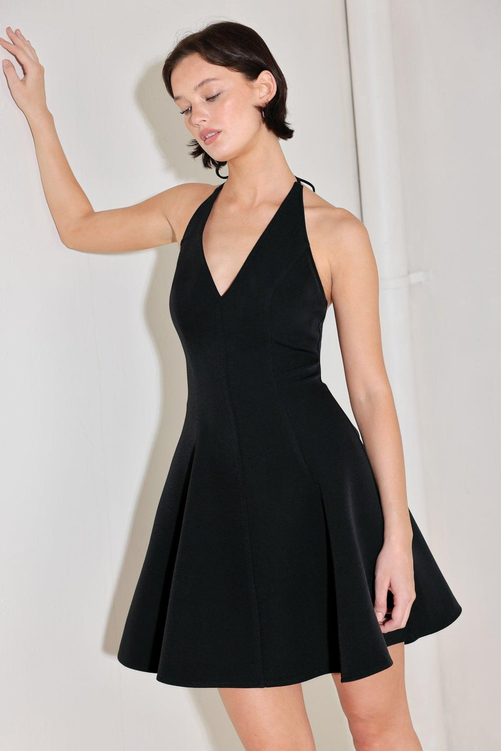 A solid woven mini dress featuring halter neckline with back neck tie, circle skirt, bare back and zipper closure

Details:

Self : 96% Polyester 4% Spandex

Size & Fit

-Model is 5`8" And Wearing Size Small
-Measurements Taken From Size Small
-Approx. Length: 36"