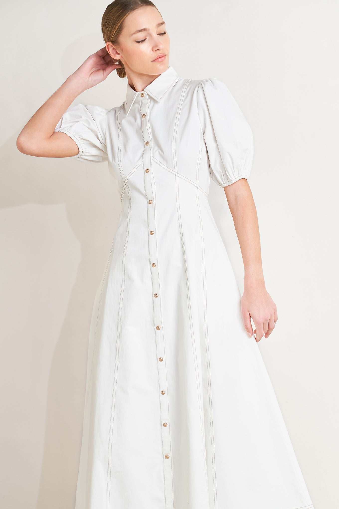 
A solid woven midi dress featuring collar, short puff sleeve, button down and circle skirt

Details:

Self : 100% Cotton
Lining : 98% Polyester 2% Cotton

Size &amp; Fit

- Model is 5`8" And Wearing Size Small
- Measurements Taken From Size Small
- Approx. Length: 48"