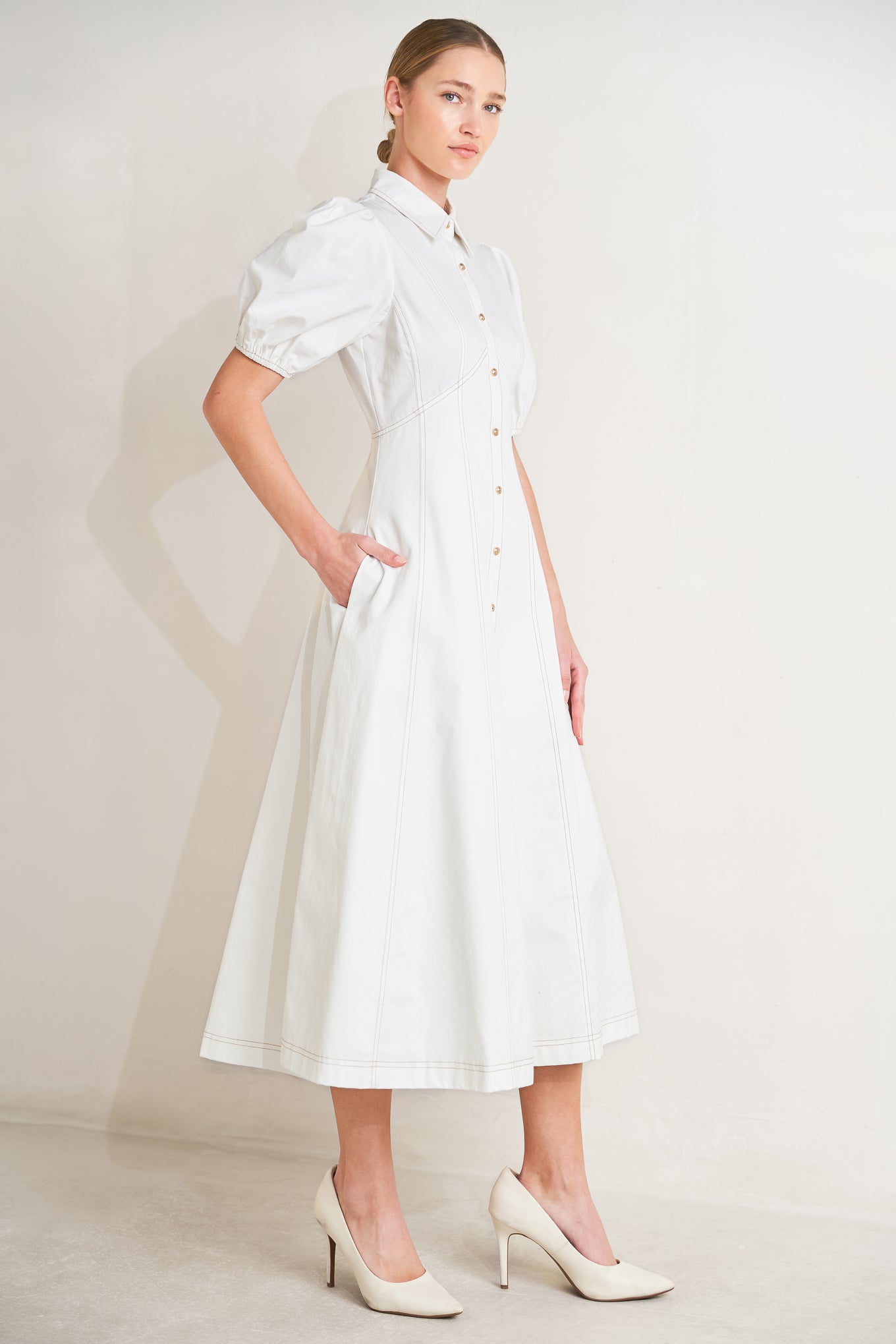 
A solid woven midi dress featuring collar, short puff sleeve, button down and circle skirt

Details:

Self : 100% Cotton
Lining : 98% Polyester 2% Cotton

Size &amp; Fit

- Model is 5`8" And Wearing Size Small
- Measurements Taken From Size Small
- Approx. Length: 48"