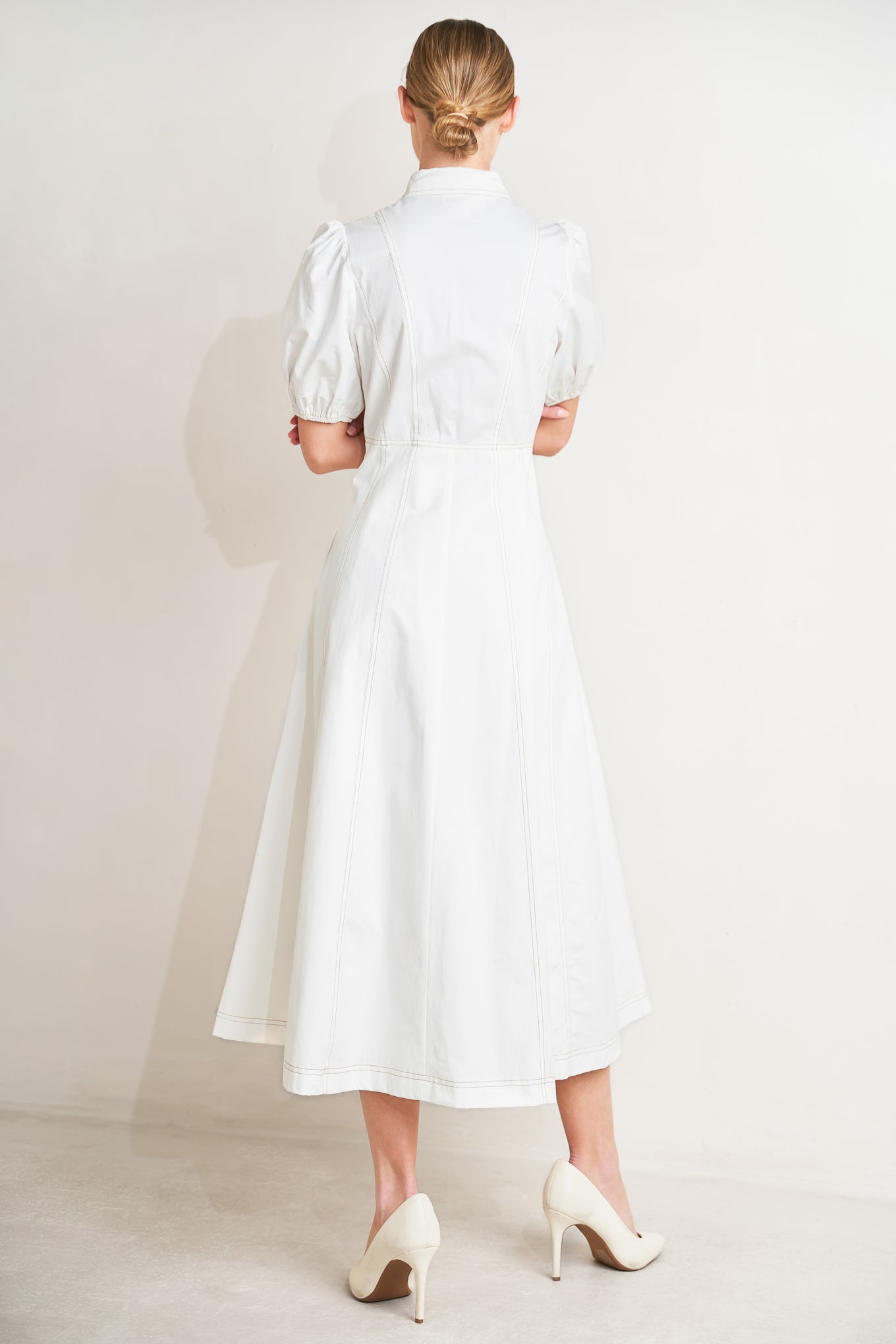 
A solid woven midi dress featuring collar, short puff sleeve, button down and circle skirt

Details:

Self : 100% Cotton
Lining : 98% Polyester 2% Cotton

Size &amp; Fit

- Model is 5`8" And Wearing Size Small
- Measurements Taken From Size Small
- Approx. Length: 48"