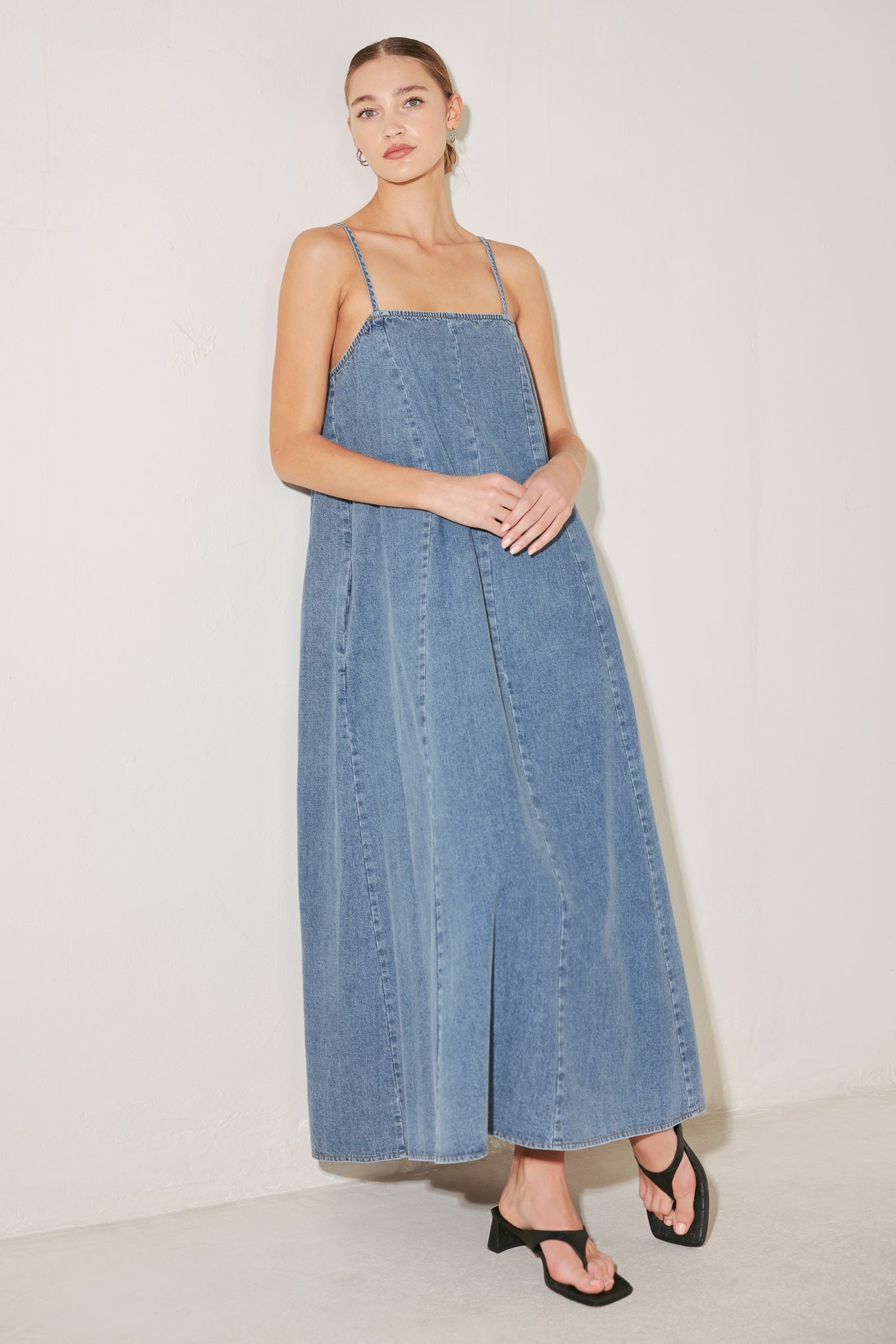 
A washed lightweight denim midi dress with straight neckline, straps and low back

Details:

Self : 90% Cotton 10% Polyester

Size &amp; Fit

- Model is 5`8" And Wearing Size Small
- Measurements Taken From Size Small
- Approx. Length: 53"