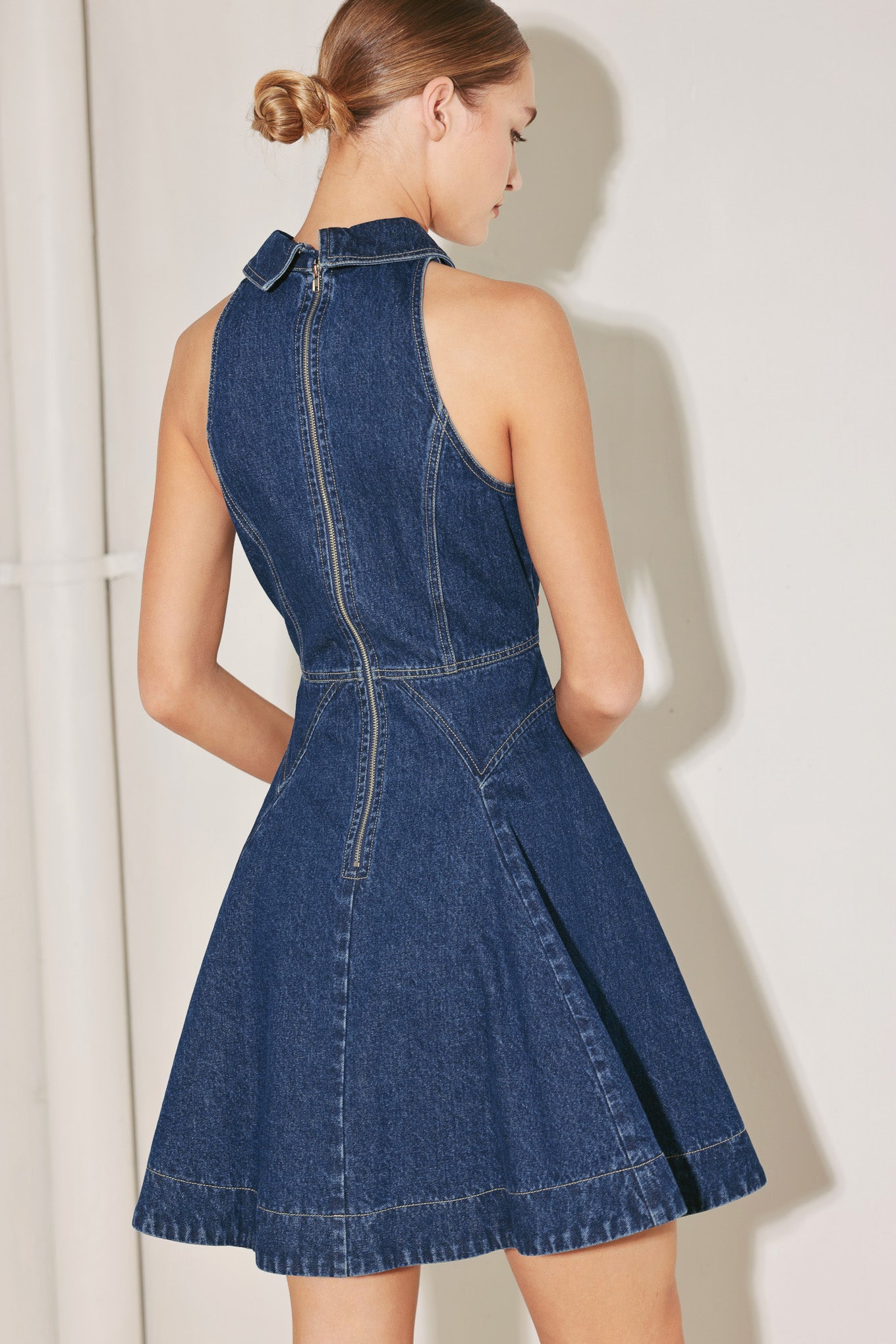 
A washed denim mini dress featuring collar, button down detail, sleeveless, full circle skirt and back zipper closure

Details:

Self : 100% Cotton

Size &amp; Fit

- Model is 5`8" And Wearing Size Small
- Measurements Taken From Size Small
- Approx. Length: 36"