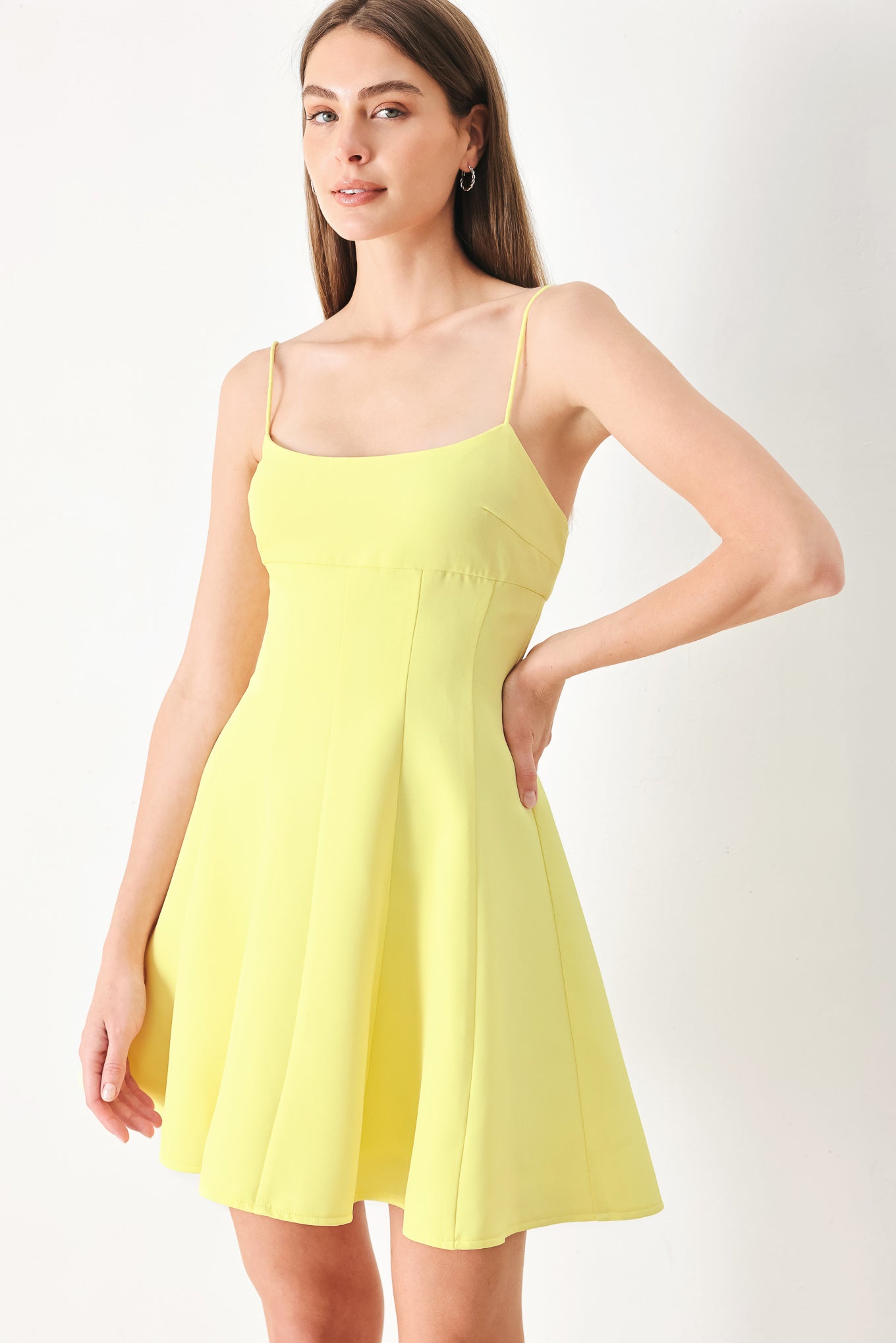 Woman wearing a yellow cami dress with strap, circle skirt and back zipper | FREEMARKET | Flying Tomato