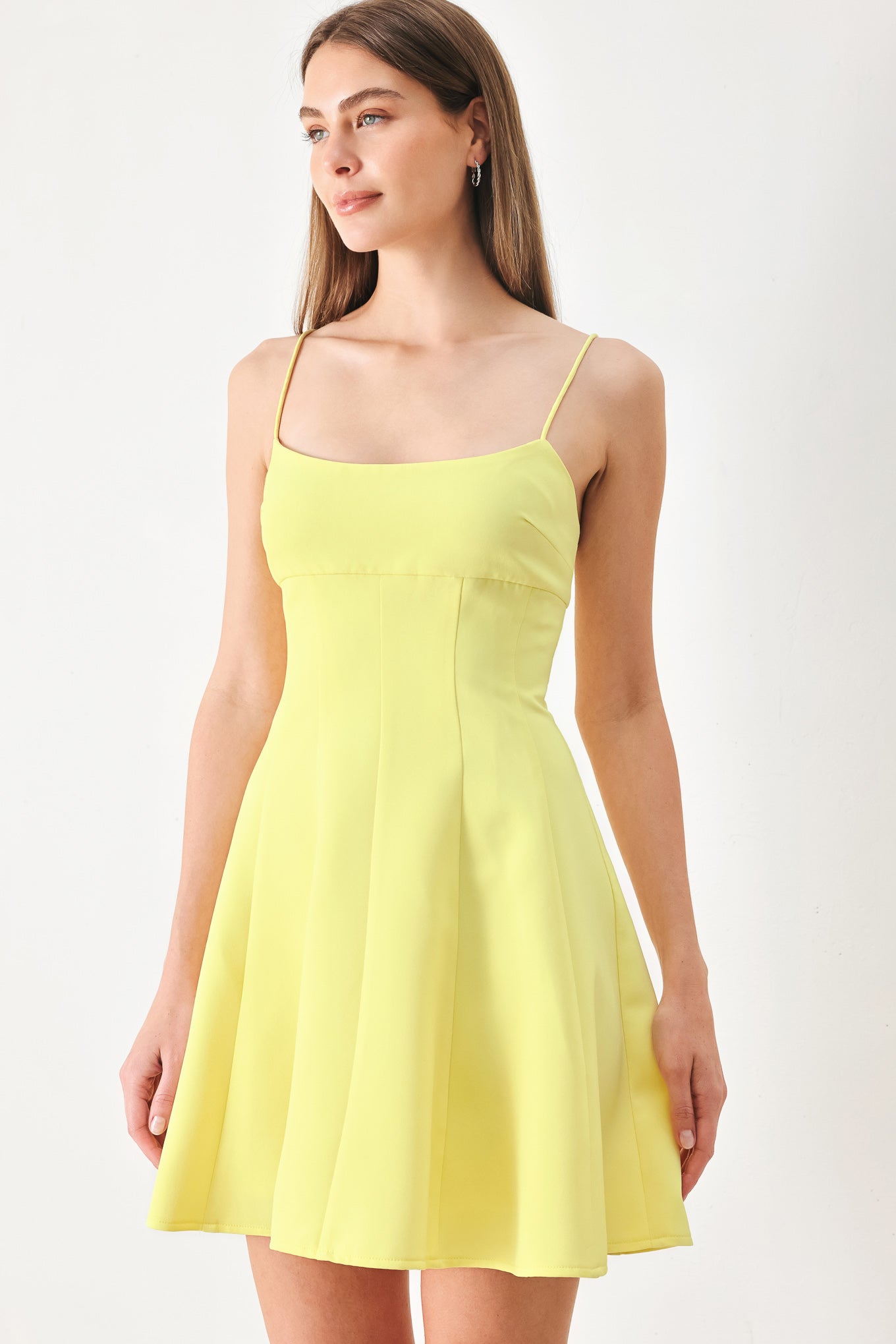 Woman wearing a yellow cami dress with strap, circle skirt and back zipper | FREEMARKET | Flying Tomato
